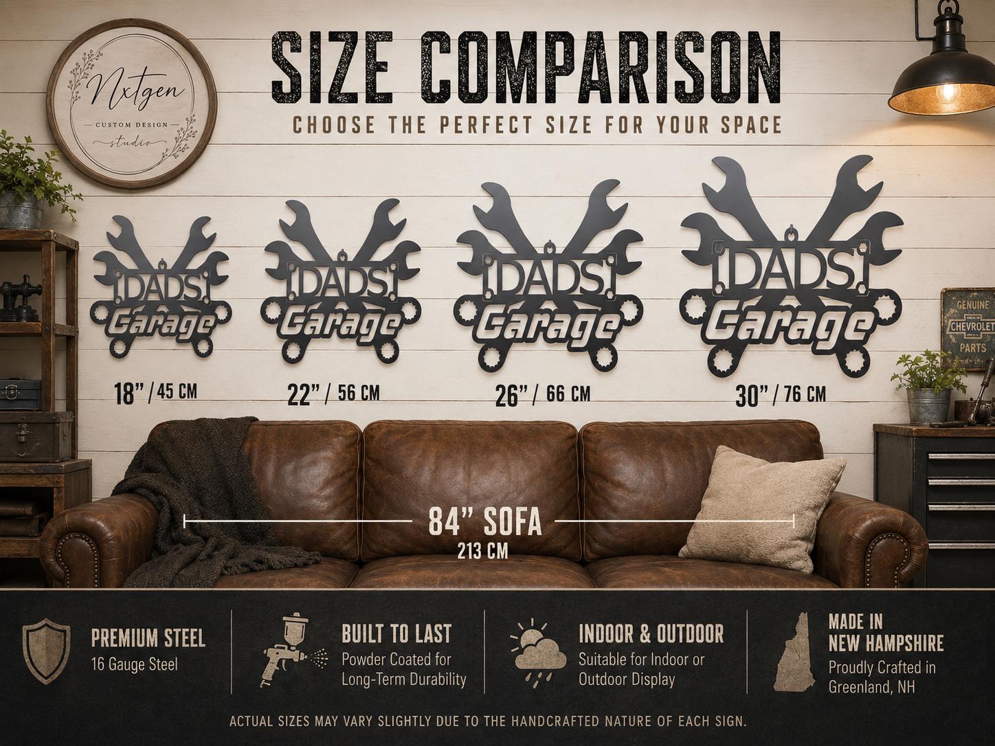 A size comparison infographic for wall signs reading 'Dads Garage,' shown above a brown leather sofa. Four black metal sign sizes are displayed at 18 inches, 22 inches, 26 inches, and 30 inches, with a sofa and wall used for scale.