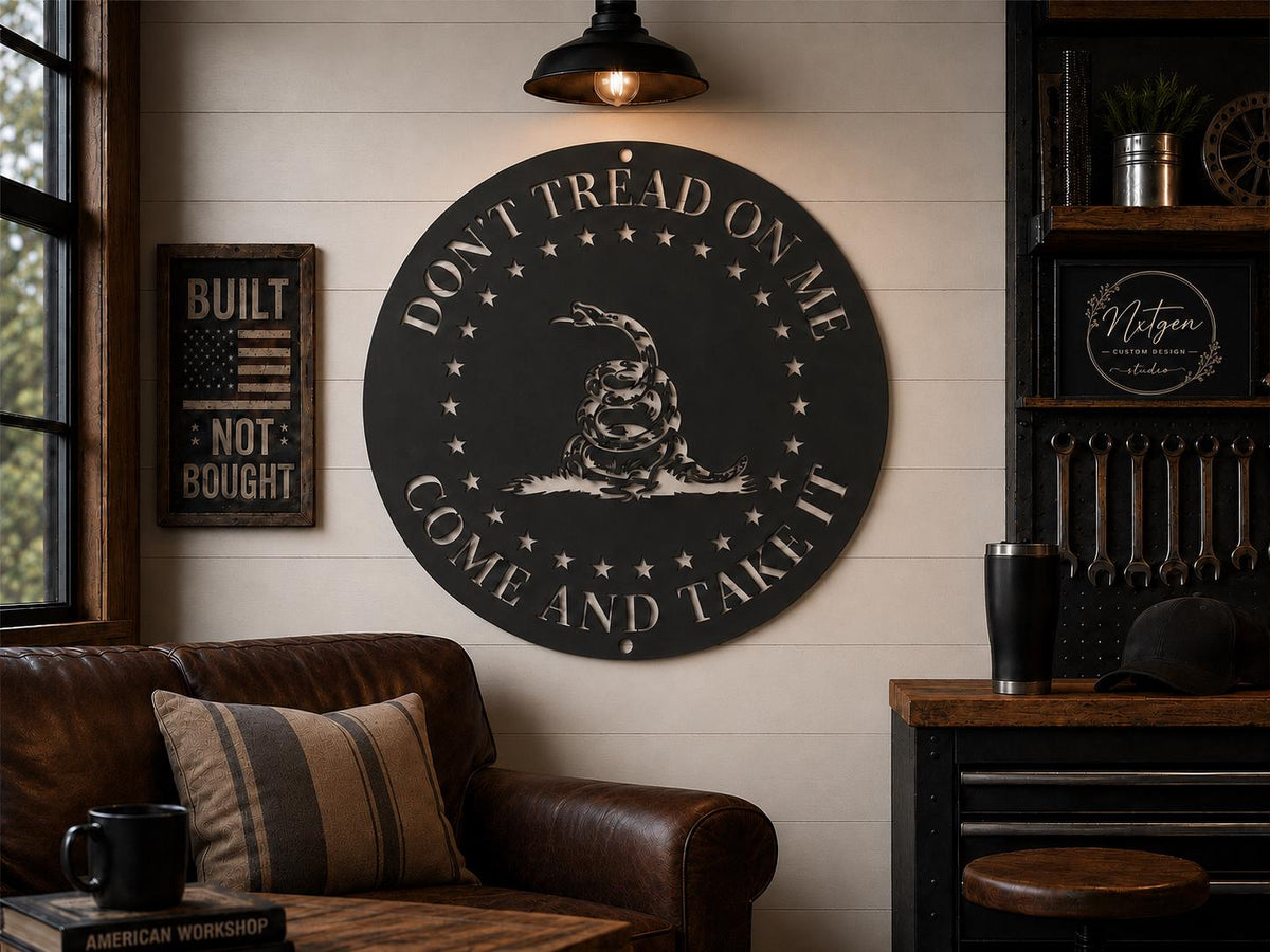 Black Don’t Tread On Me metal sign displayed above a leather sofa in a rustic workshop