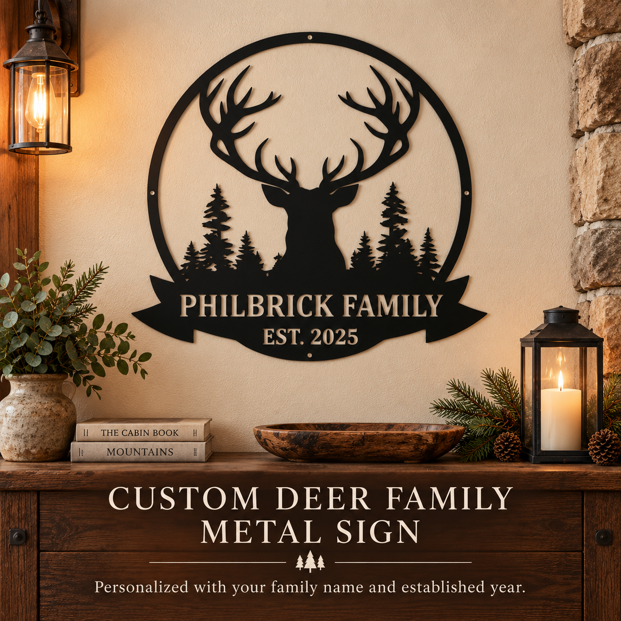 A black metal deer family sign mounted on a beige wall above a wooden console. The sign features a stag silhouette with pine trees and the text 'PHILBRICK FAMILY EST.