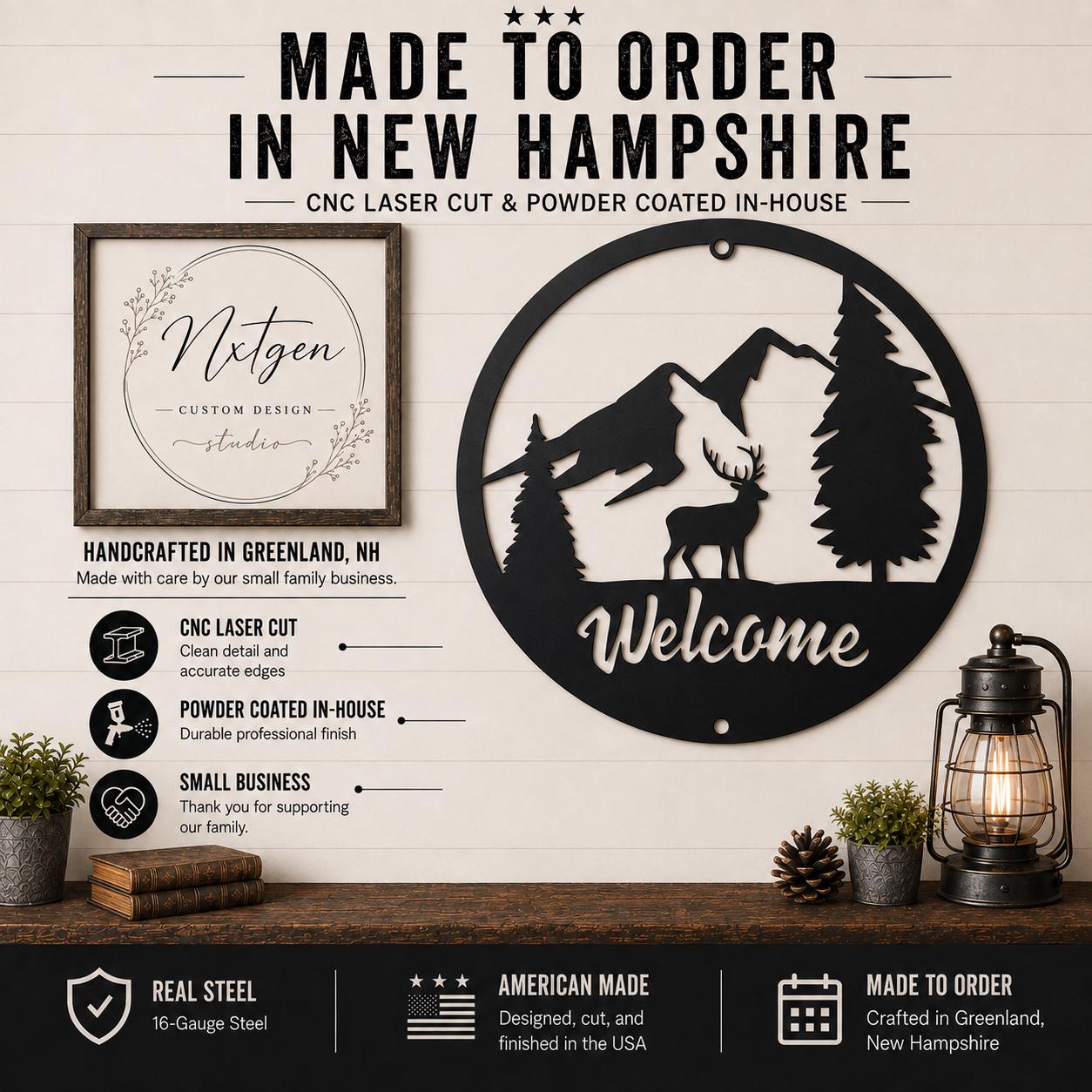 A framed circular metal wall sign with a mountain and deer silhouette and the word 'Welcome' in white, displayed on a rustic shelf beside a lantern and plants. Large text above reads 'MADE TO ORDER IN NEW HAMPSHIRE' and includes a custom design logo and feature callouts for CNC laser cut, powder coated finish, and American made.